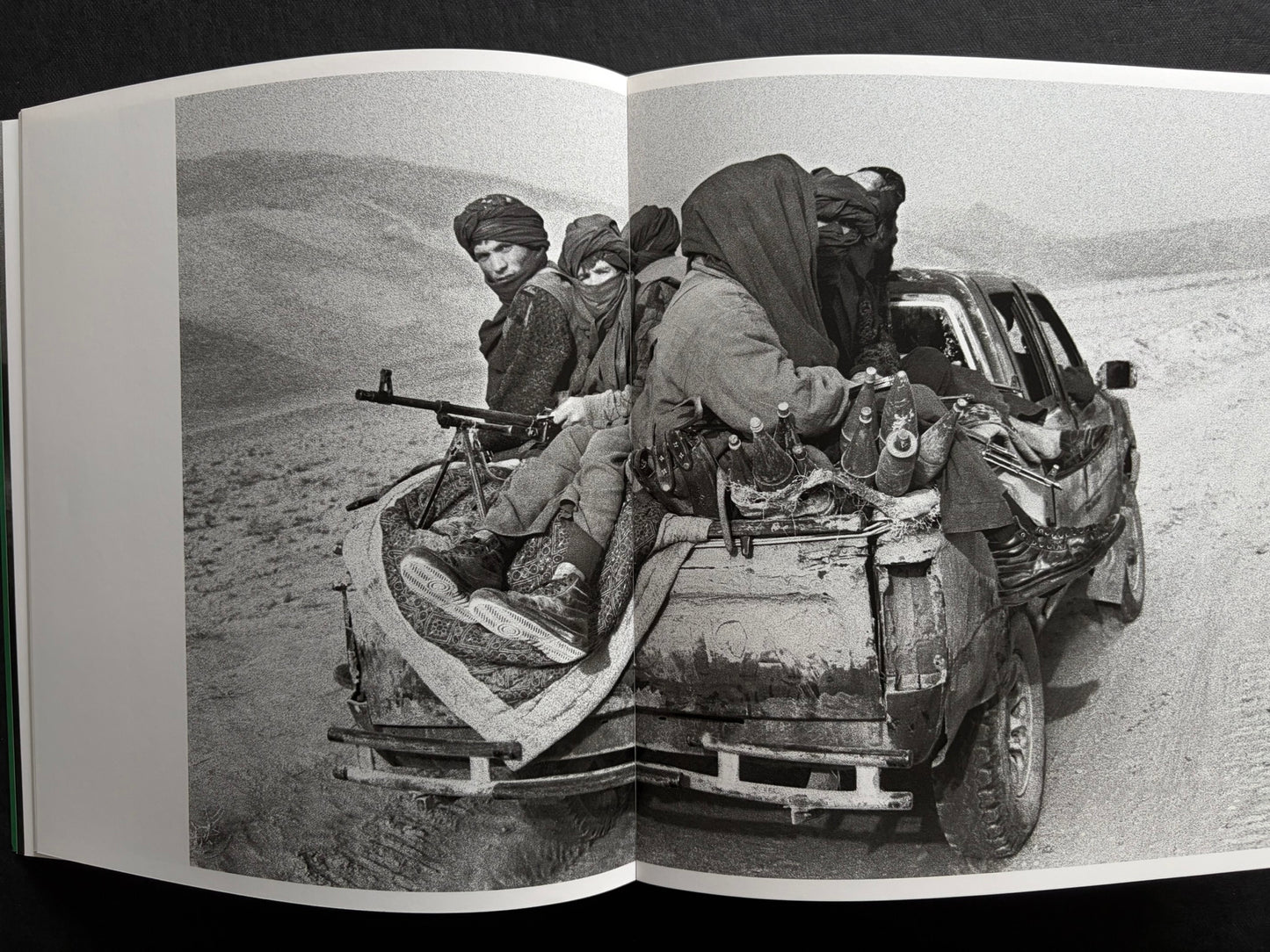 Index by Christopher Anderson, spread with a black-and-white portrait on the left and a group riding in a vehicle on the right.