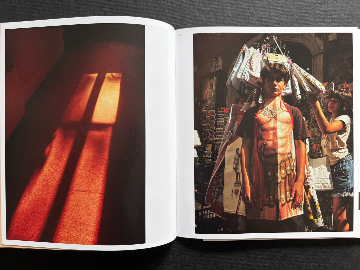 Index by Christopher Anderson, spread with a red-lit interior on the left and a portrait of a person in costume on the right.