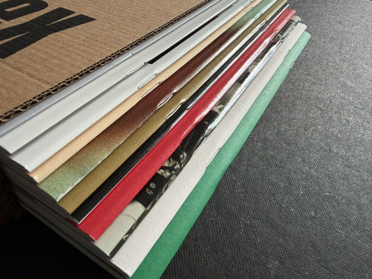 Index by Christopher Anderson, open slipcase showing the stacked volumes inside.