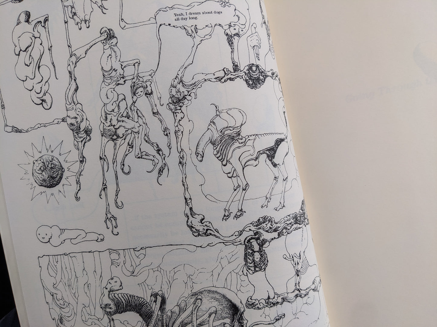 Open spread of black-and-white comic pages with skeletal figures, speech bubbles, and surreal line drawings.