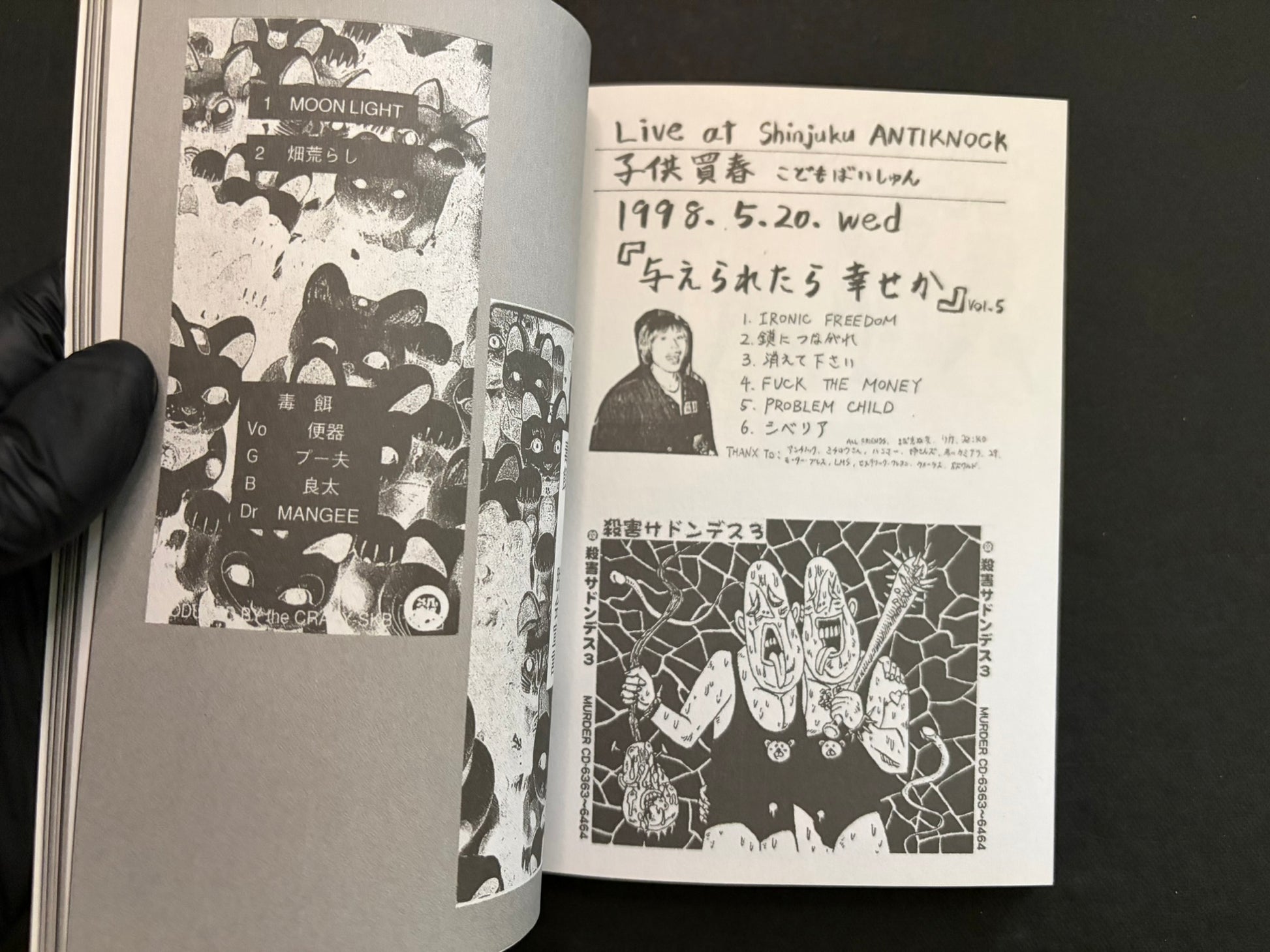 Interior spread of Japanese Punk Graphics (1980–2010) with handwritten set lists and dense flyer imagery