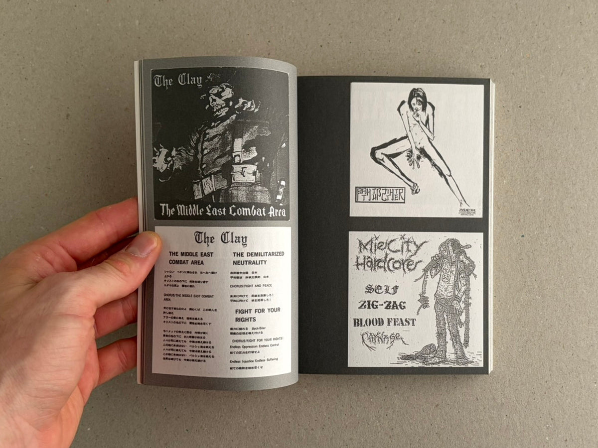 Open spread from Japanese Punk Graphics (1980-2010), showing black-and-white punk graphics and typography on two pages, held open by a hand.