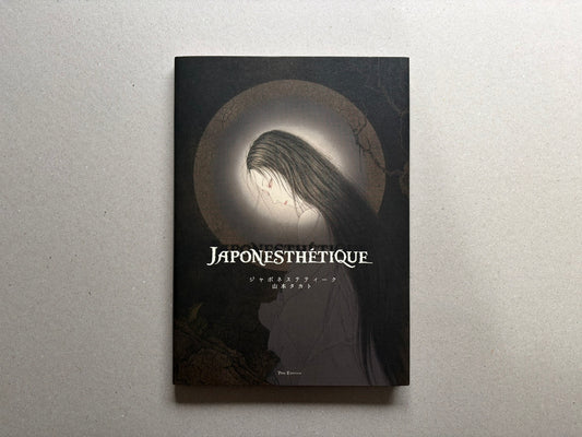 Front cover of Japonesthétique by Takato Yamamoto, showing a pale figure with long dark hair against a dark circular halo.