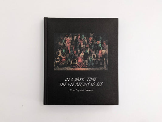 Front cover of “In a Dark Time, the Eye Begins to See: The Art of Julia Soboleva” (The Mansion Press), black clothbound hardcover with a group portrait illustration.