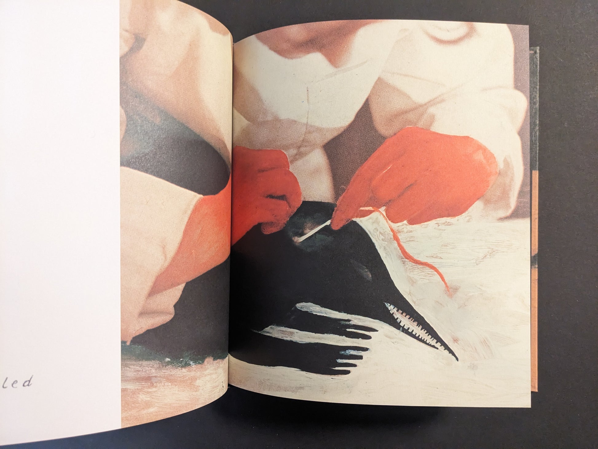 Interior artwork from Julia Soboleva’s “In a Dark Time, the Eye Begins to See,” close-up of red-gloved hands sewing or handling a white bird-like form.