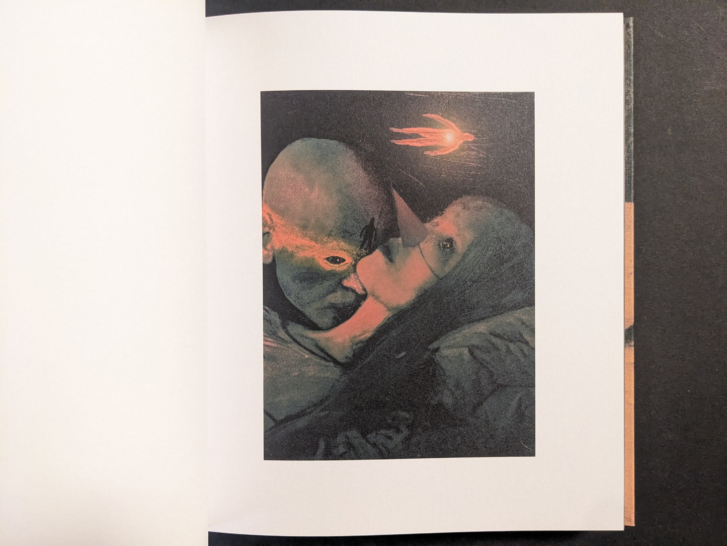 Interior artwork from “In a Dark Time, the Eye Begins to See” by Julia Soboleva, depicting two faces in close embrace with a red comet-like form above.
