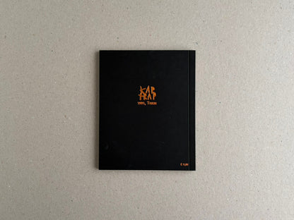 Back cover of KAP TRAP with gold foil illustration on a black background.