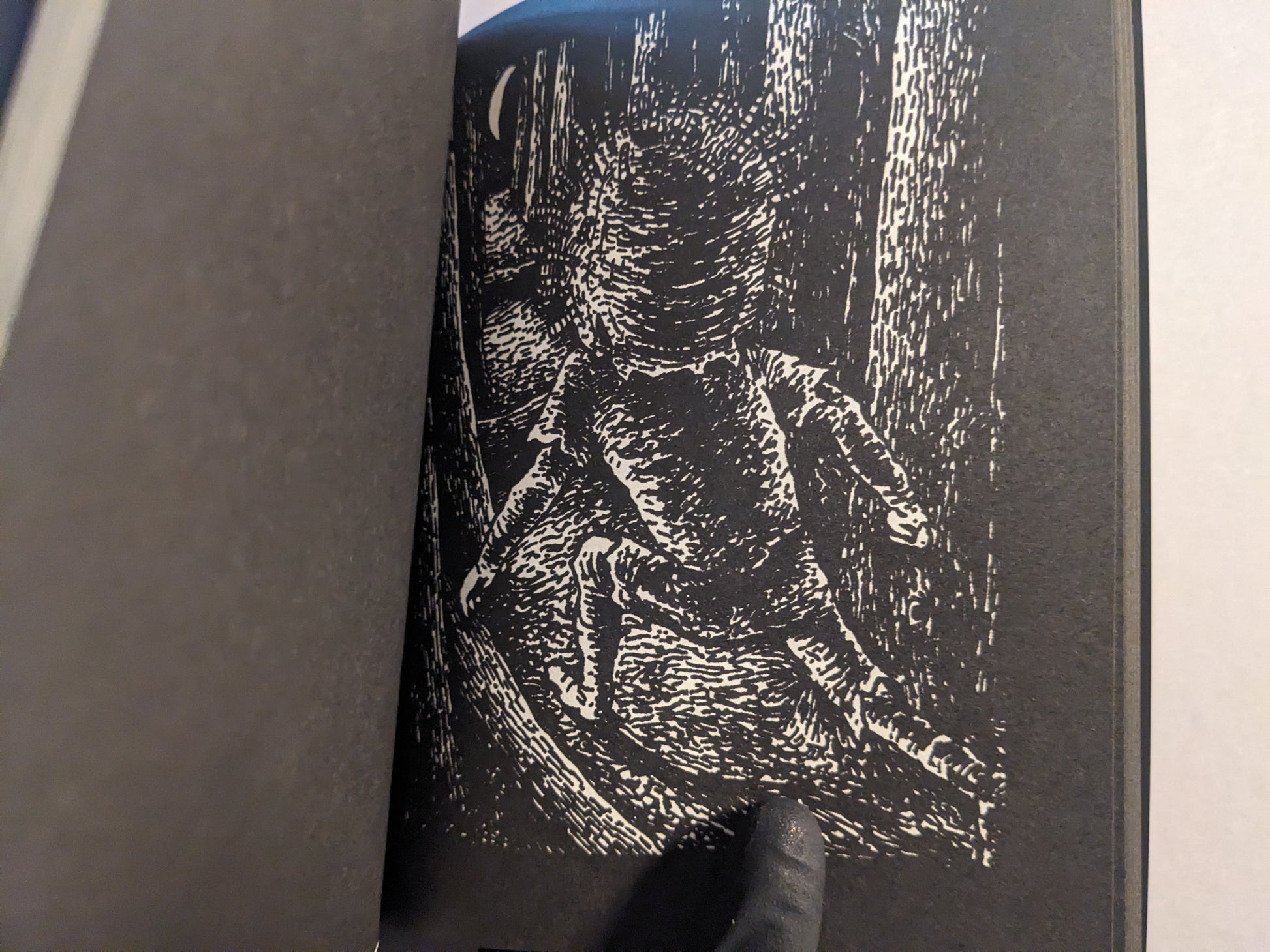 Black-and-white interior page showing a figure running through a forest.