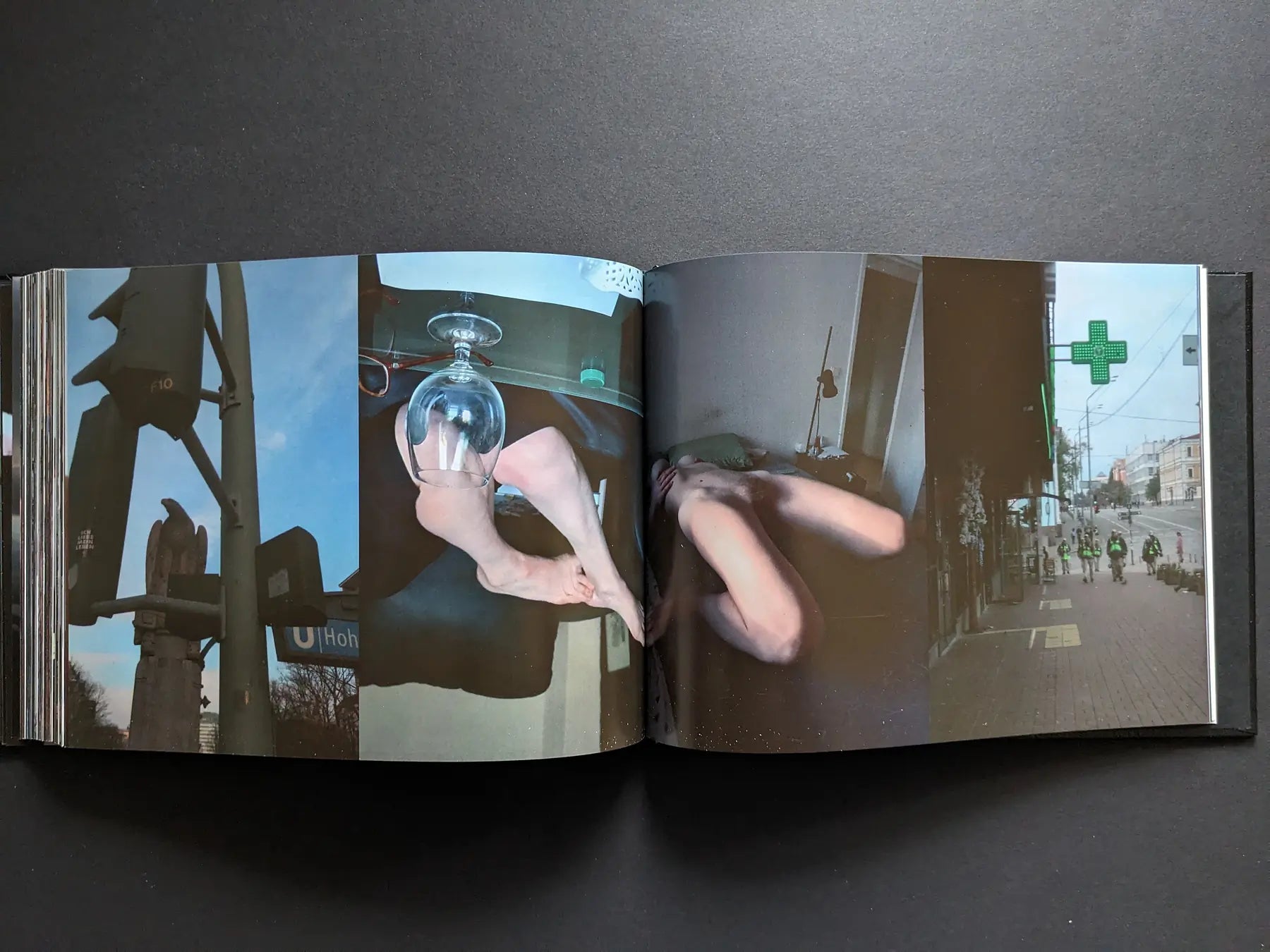 Traffic lights, a nude body with a glass on the legs, a blurred figure on a bed, and a night street with uniformed workers.