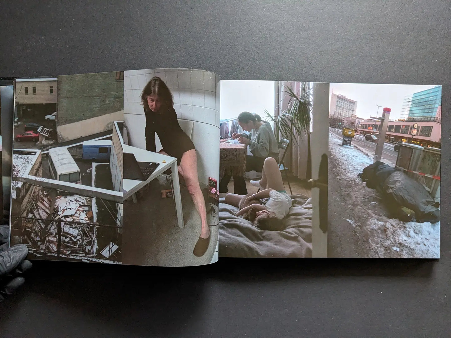 Interior spread with a courtyard view, a woman posing indoors, two people on a bed, and a winter street scene.