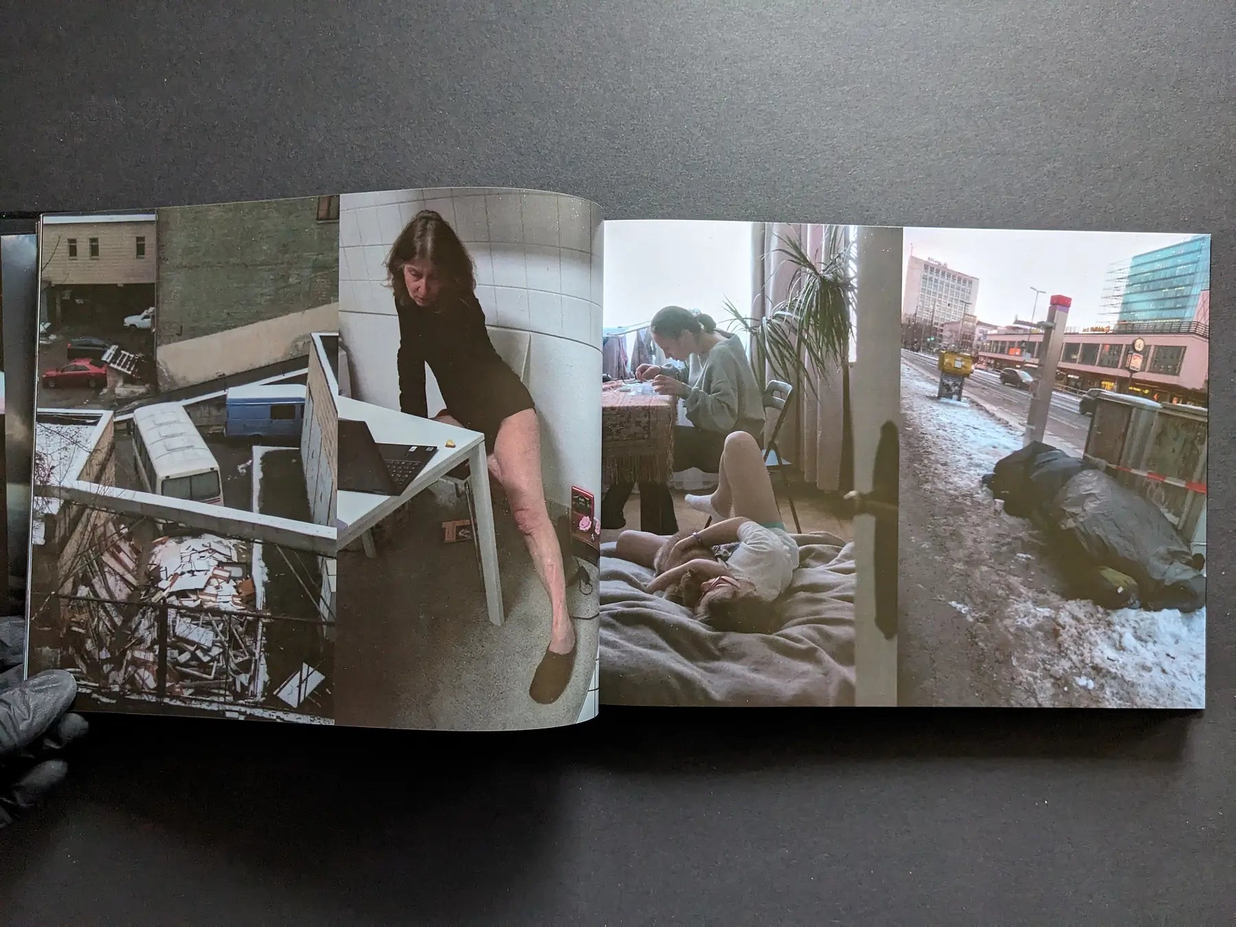 Interior spread with a courtyard view, a woman posing indoors, two people on a bed, and a winter street scene.