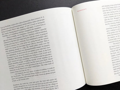 Close view of English essay pages titled “Blindsights” from Boris Mikhailov’s photobook Keep Distance.