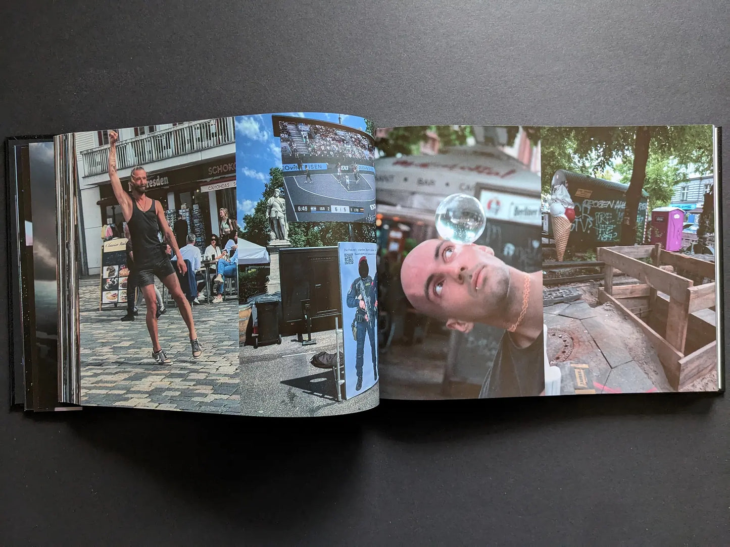 Street scenes and performers, including a dancer and a man balancing a glass sphere, from Boris Mikhailov’s photobook Keep Distance.
