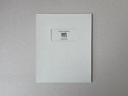 Front cover of Toshio Shibata, Landscape Collotype Portfolio, with a small central label on a pale grey cover.