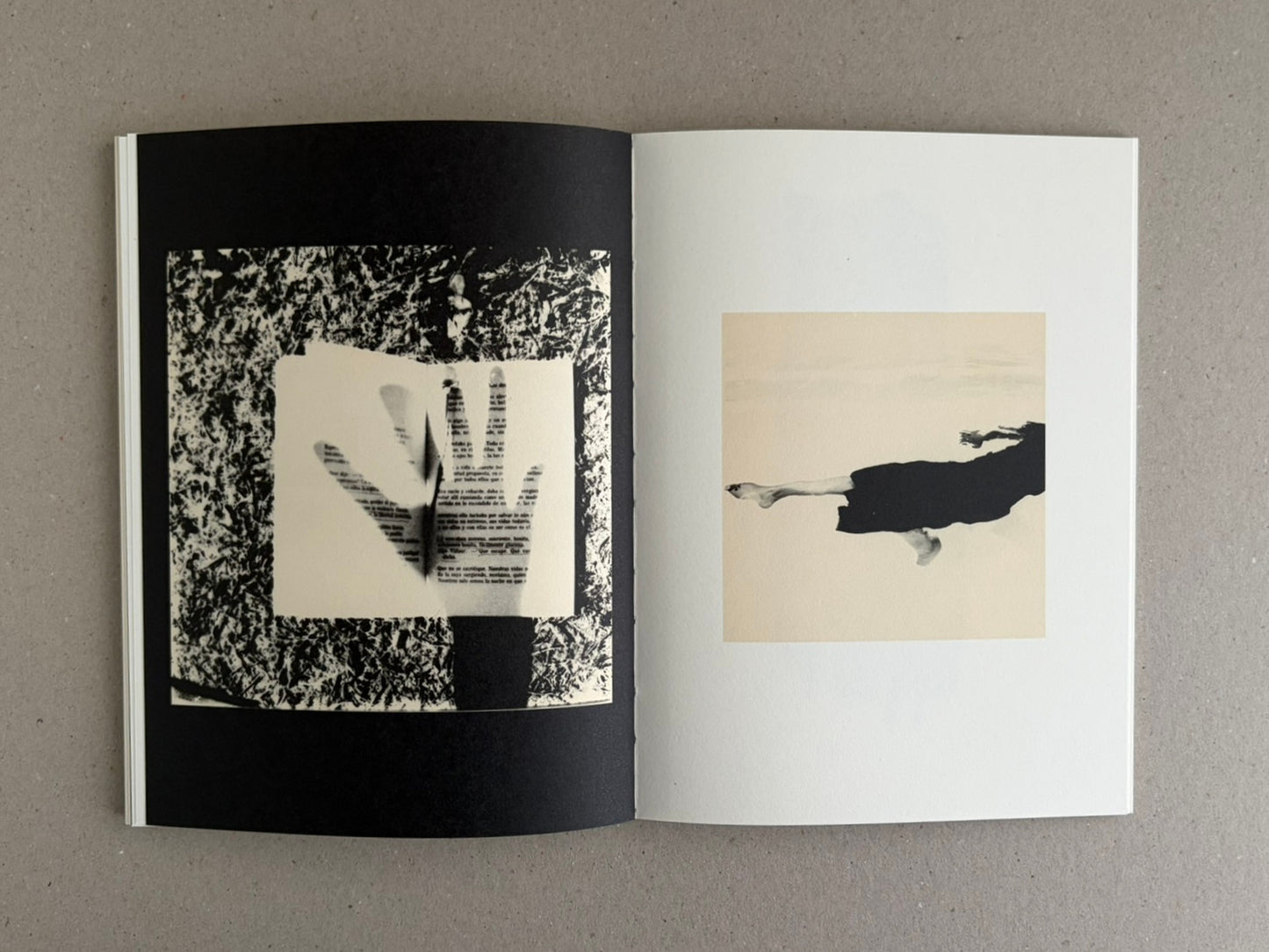 Open photobook spread from Lejos De La Tierra – Irene Zottola, showing abstract black-and-white imagery on the left page and a pale square image with a dark horizontal form on the right page.