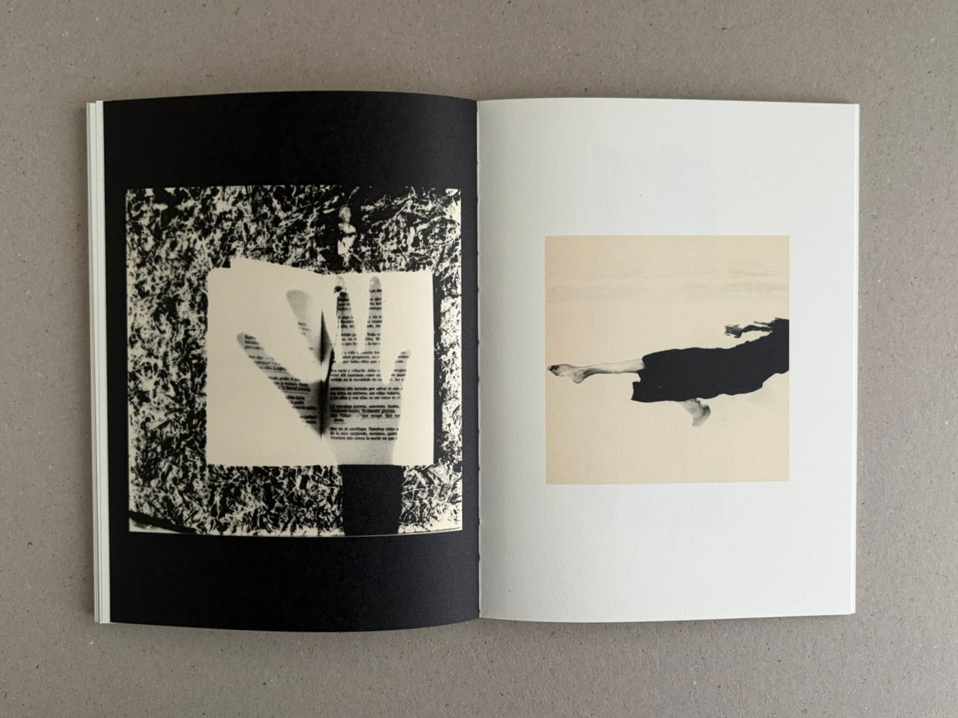 Open photobook spread from Lejos De La Tierra – Irene Zottola, showing abstract black-and-white imagery on the left page and a pale square image with a dark horizontal form on the right page.