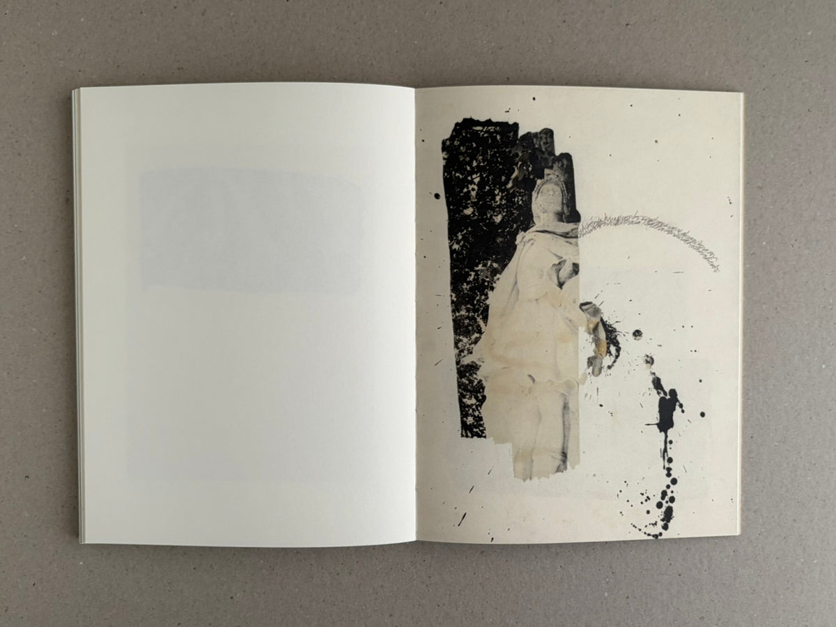 Open photobook spread from Lejos De La Tierra – Irene Zottola, with a mostly blank left page and a right page showing a collage-like figure with black ink splatters.
