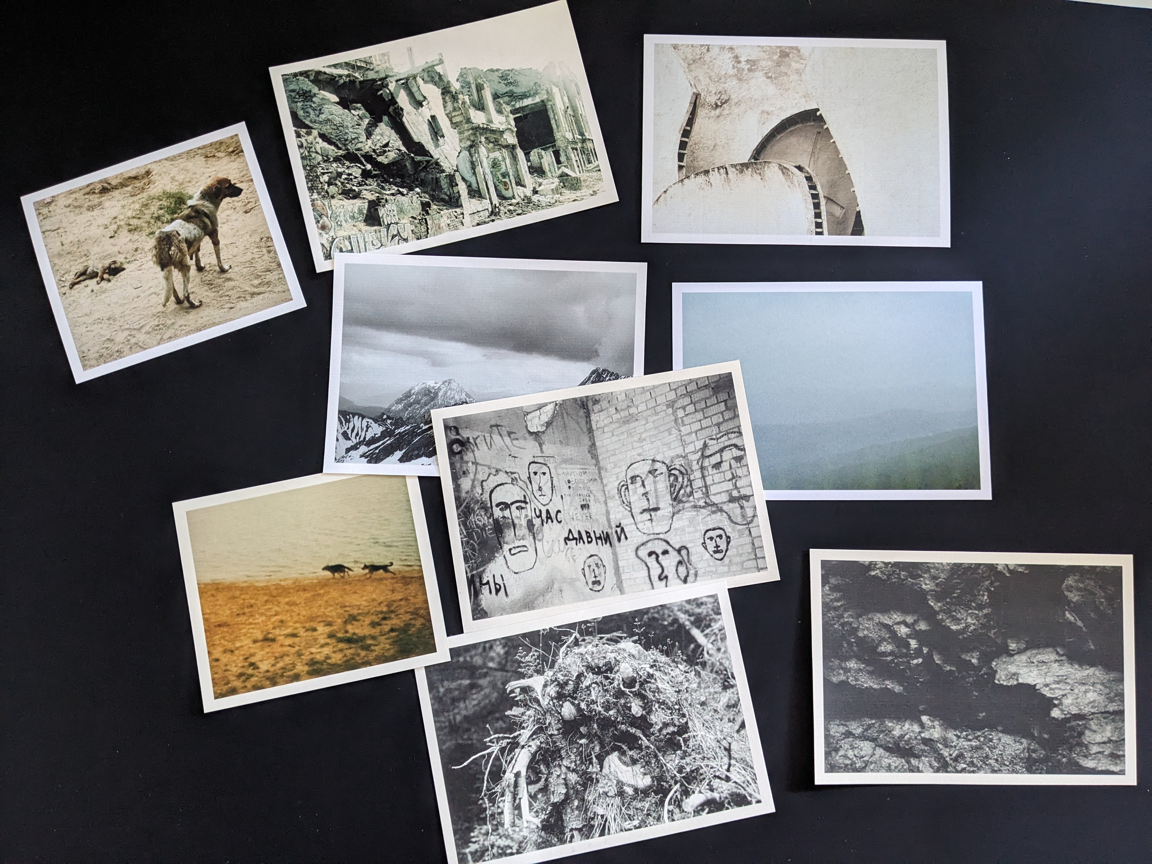 Set of analog postcards from Lokator100, printed on thick matte paper, showing various scenes of urban decay, landscapes, and abstract textures.