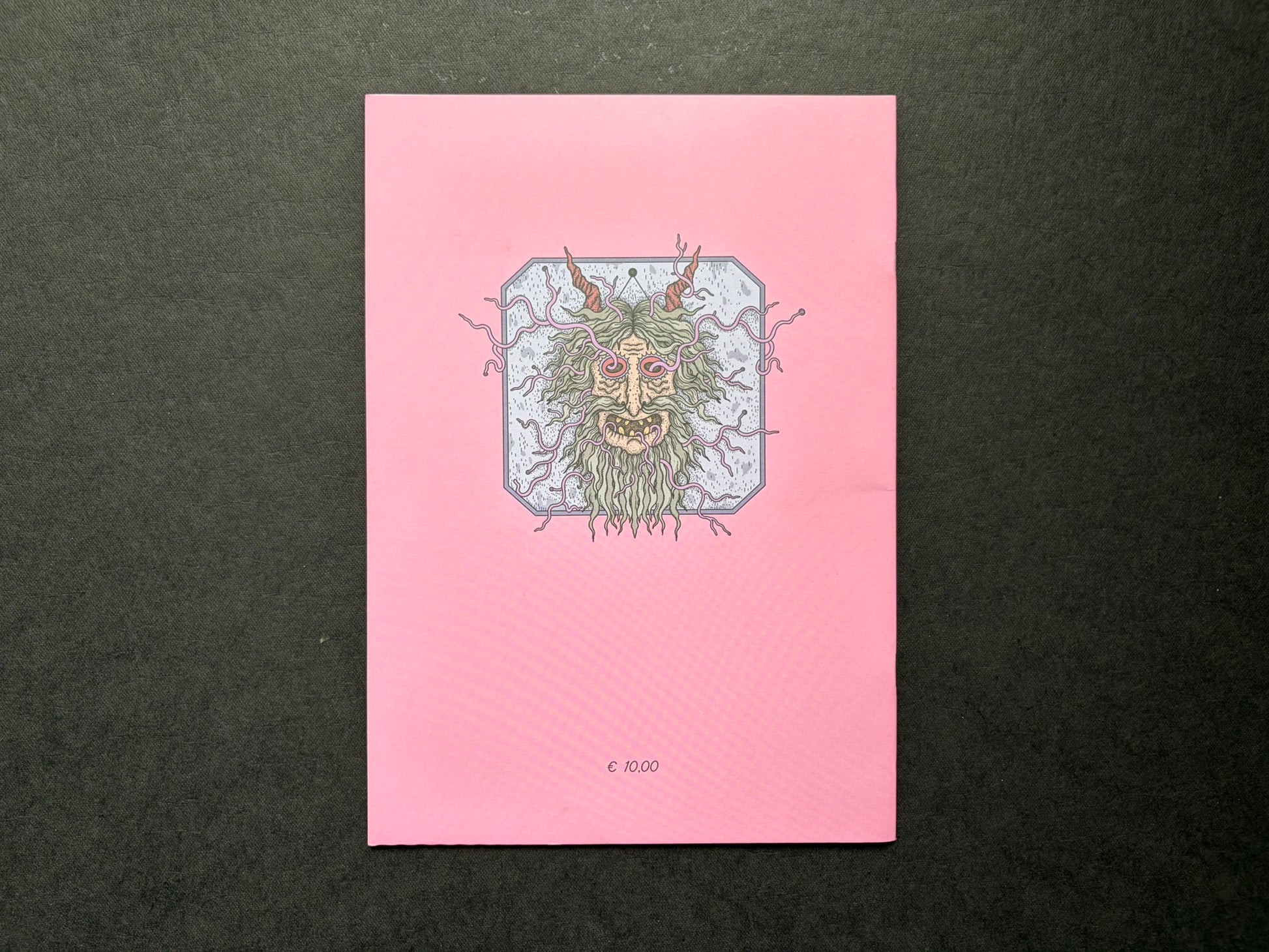 Mana by Dina Omut, back cover with pink background and central face illustration