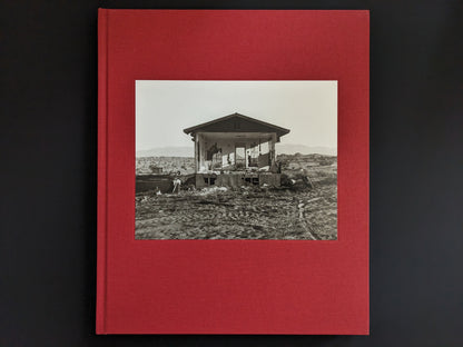 Cover of the book 'Message from the Exterior' by Mark Ruwedel with tipped-in black-and-white photo on red cloth.