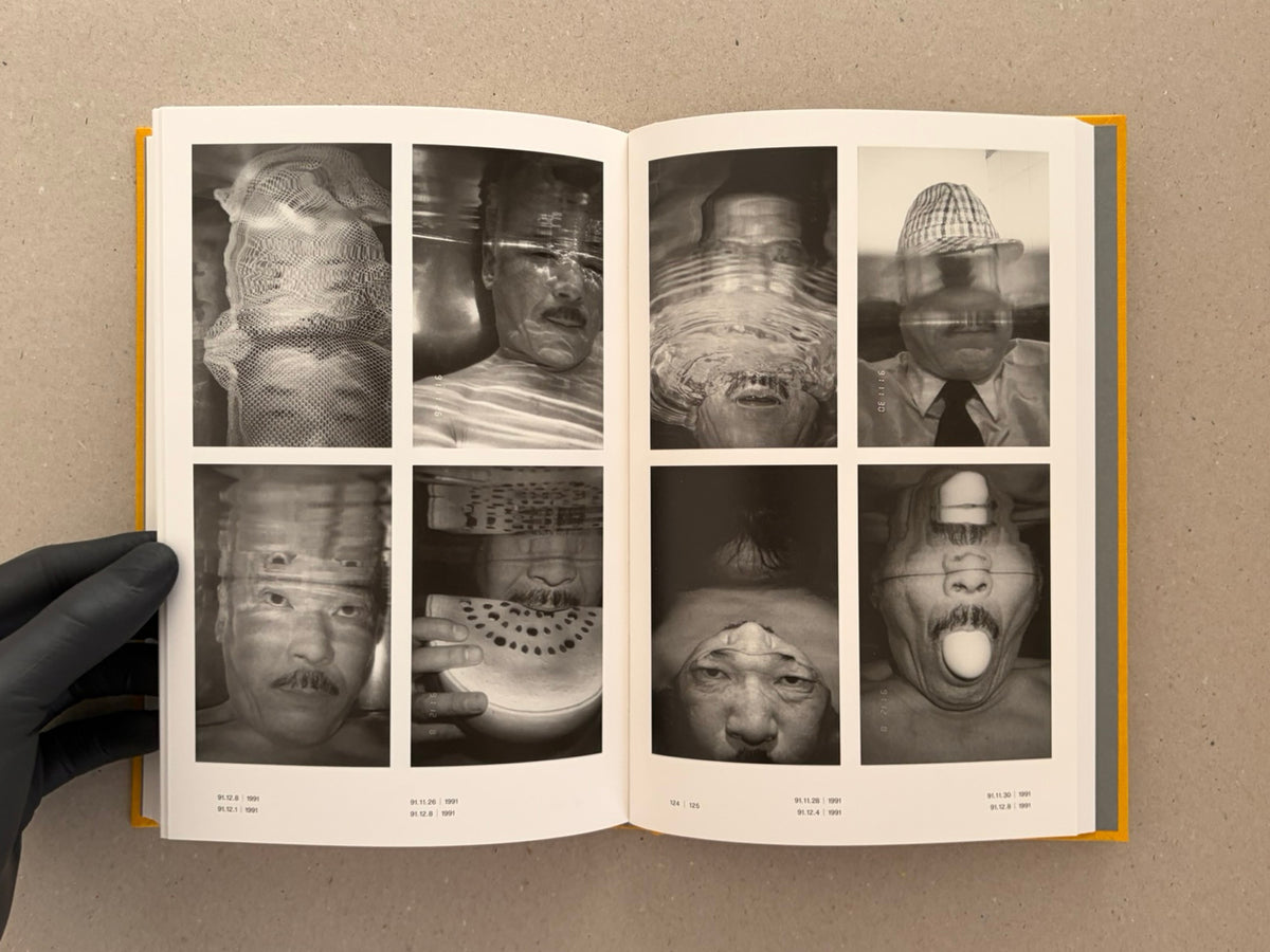 Open spread from Masahisa Fukase 1961–1991 Retrospective showing a grid of black-and-white self-portrait photographs, with page numbers visible at the bottom.