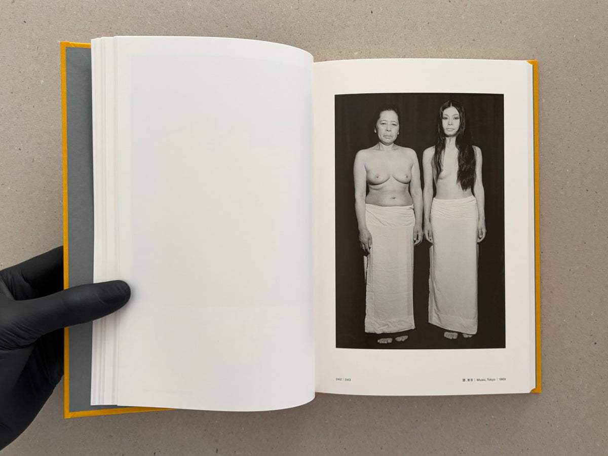 Open spread of Masahisa Fukase 1961–1991 Retrospective, showing a black-and-white photograph on the right-hand page and a blank left-hand page.