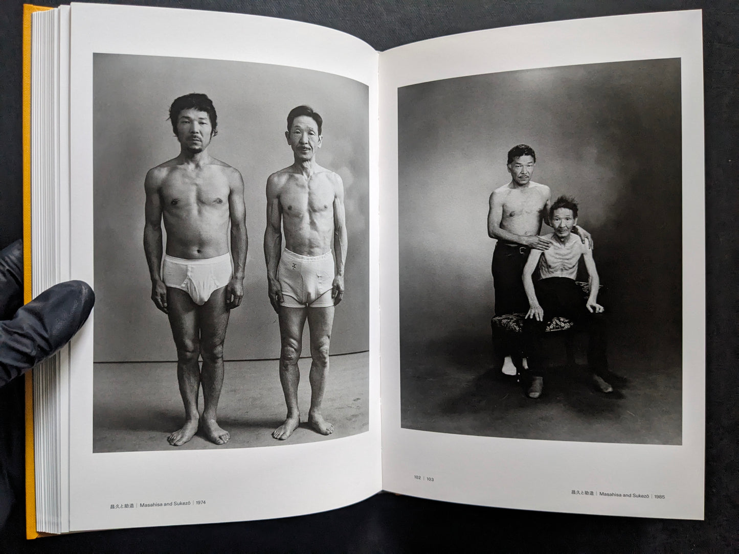 Open spread with studio portraits of Masahisa Fukase and Sukezo, standing and seated.