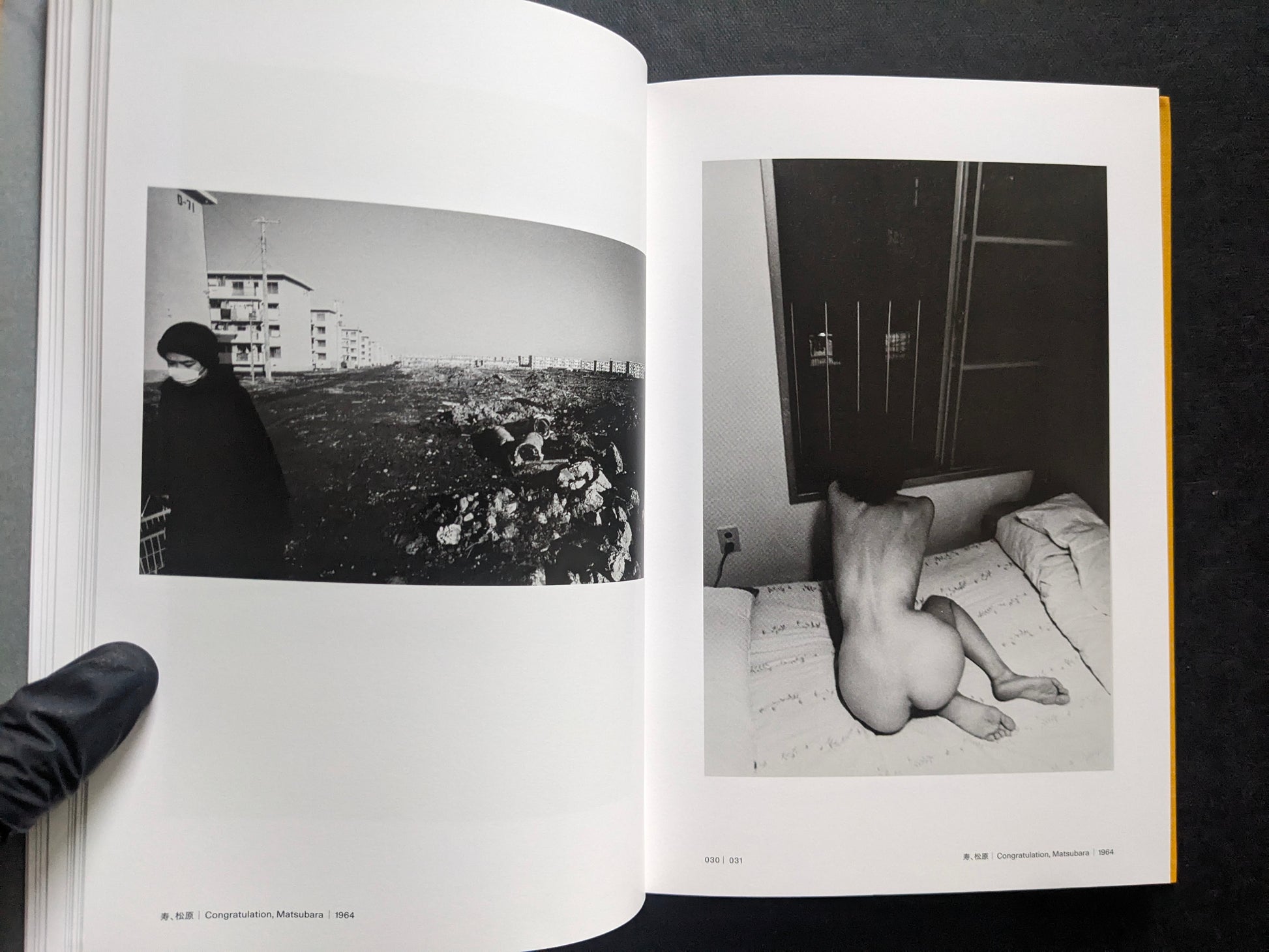 Open spread with a black-and-white street scene on the left and a nude figure on a bed on the right.