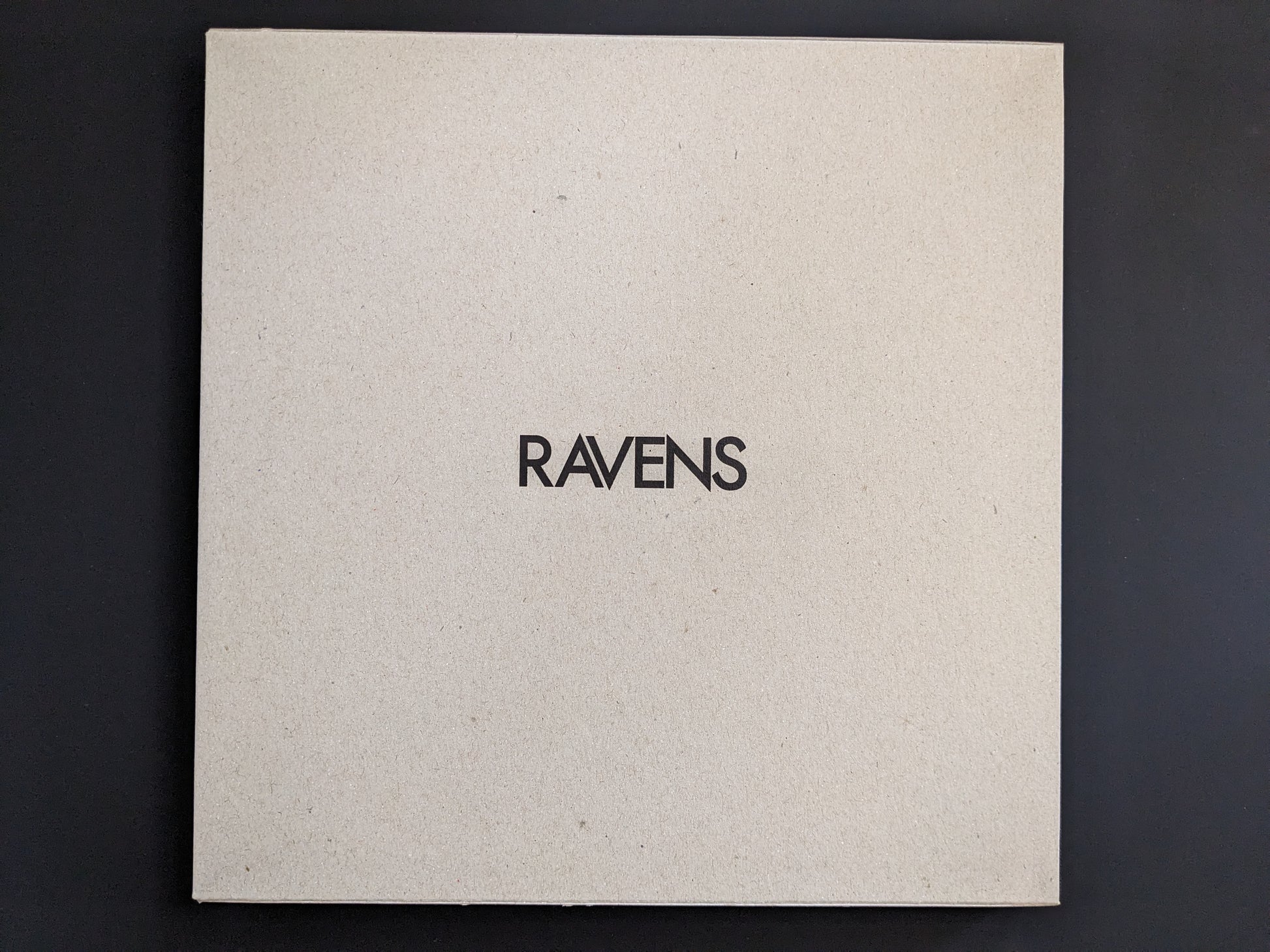 Front cover of "Ravens" by Masahisa Fukase with English title on natural cardboard.