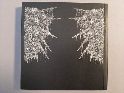 Back cover of Manifester Monsters art book by Mat Brinkman with silver printed artwork