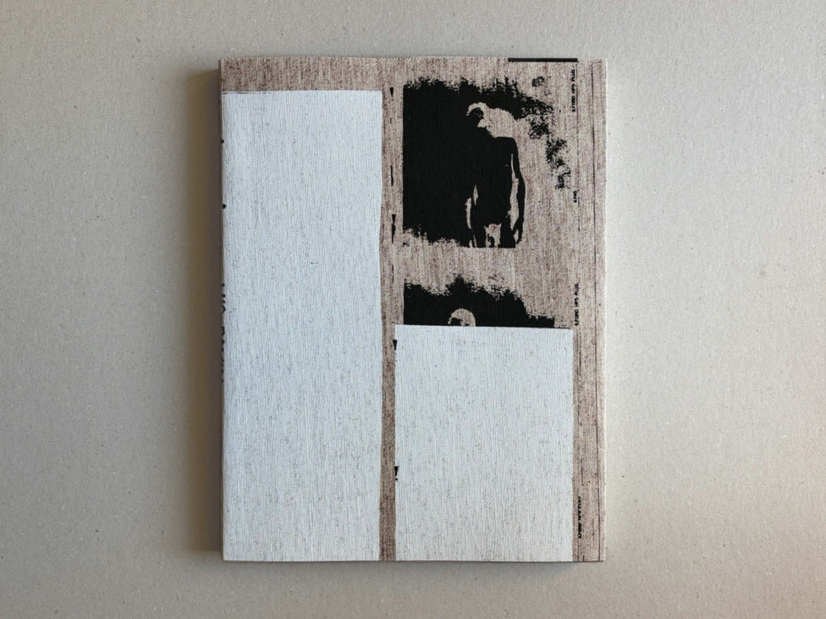 Materia by Vic Bakin, cover with a muted abstract image and pale rectangular overlays