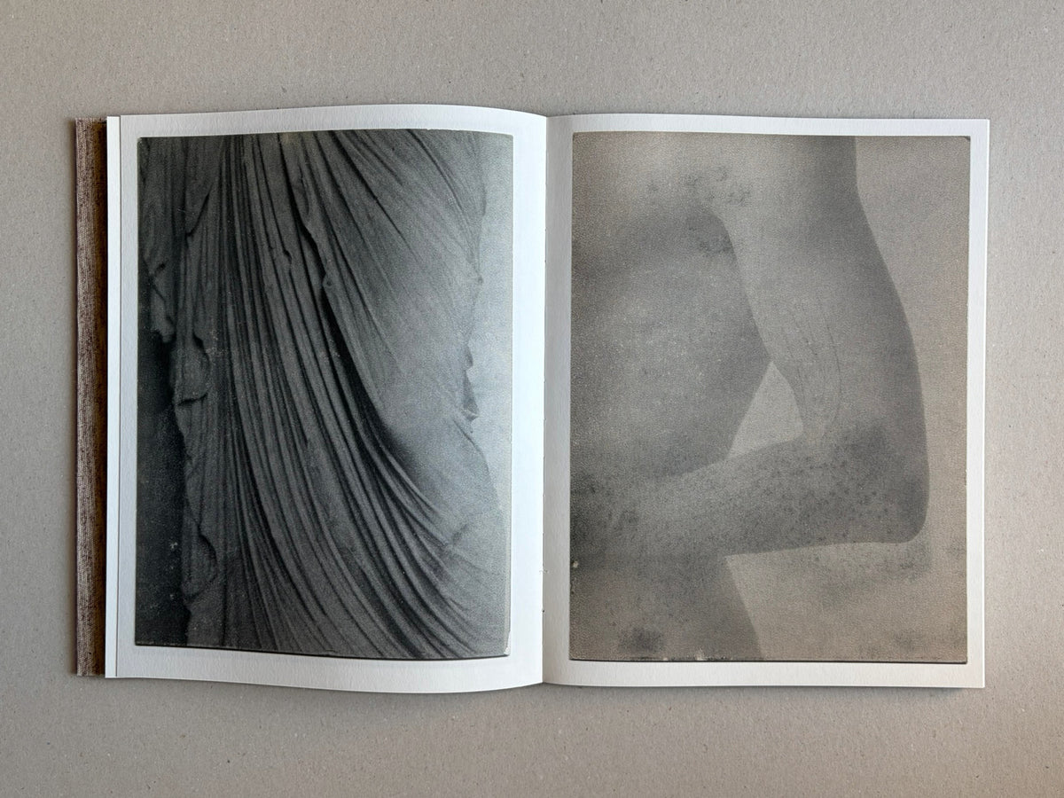 Open spread of Materia by Vic Bakin, showing two grayscale photographic prints on facing pages.