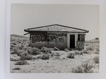 Desert house covered in graffiti