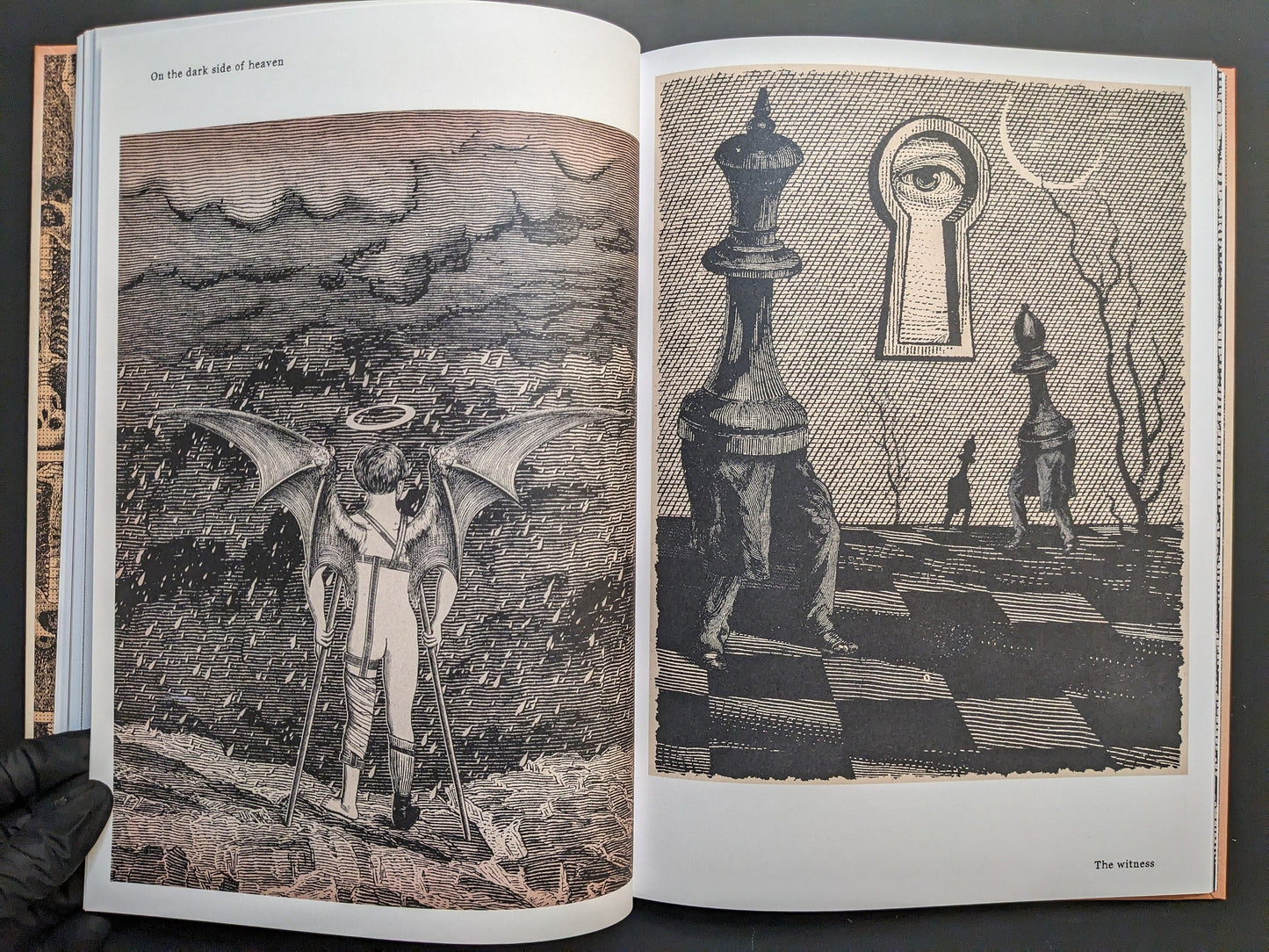 Double-page spread from METAFABLES, showing an interior detail and a falling figure in a scene titled On the dark side of heaven.