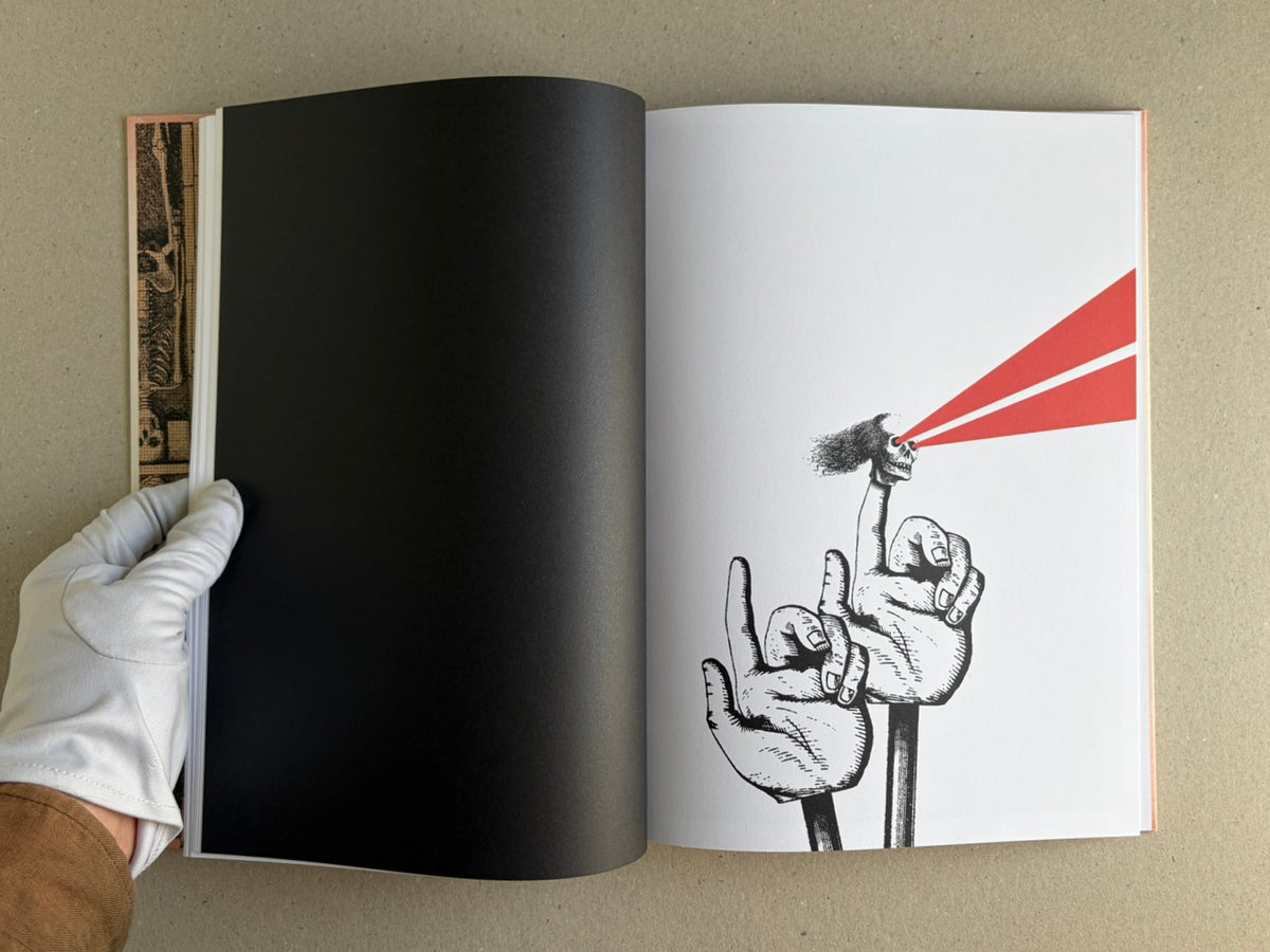 Open spread of METAFABLES: The Art of Andrew Blucha, showing a black left page and a right page with a black line drawing of hands holding a skull emitting two red beams.