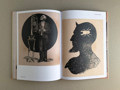 Open spread from METAFABLES: The Art of Andrew Blucha showing two monochrome illustrations on cream paper, including a skeletal musician and a profile silhouette with an insect motif.