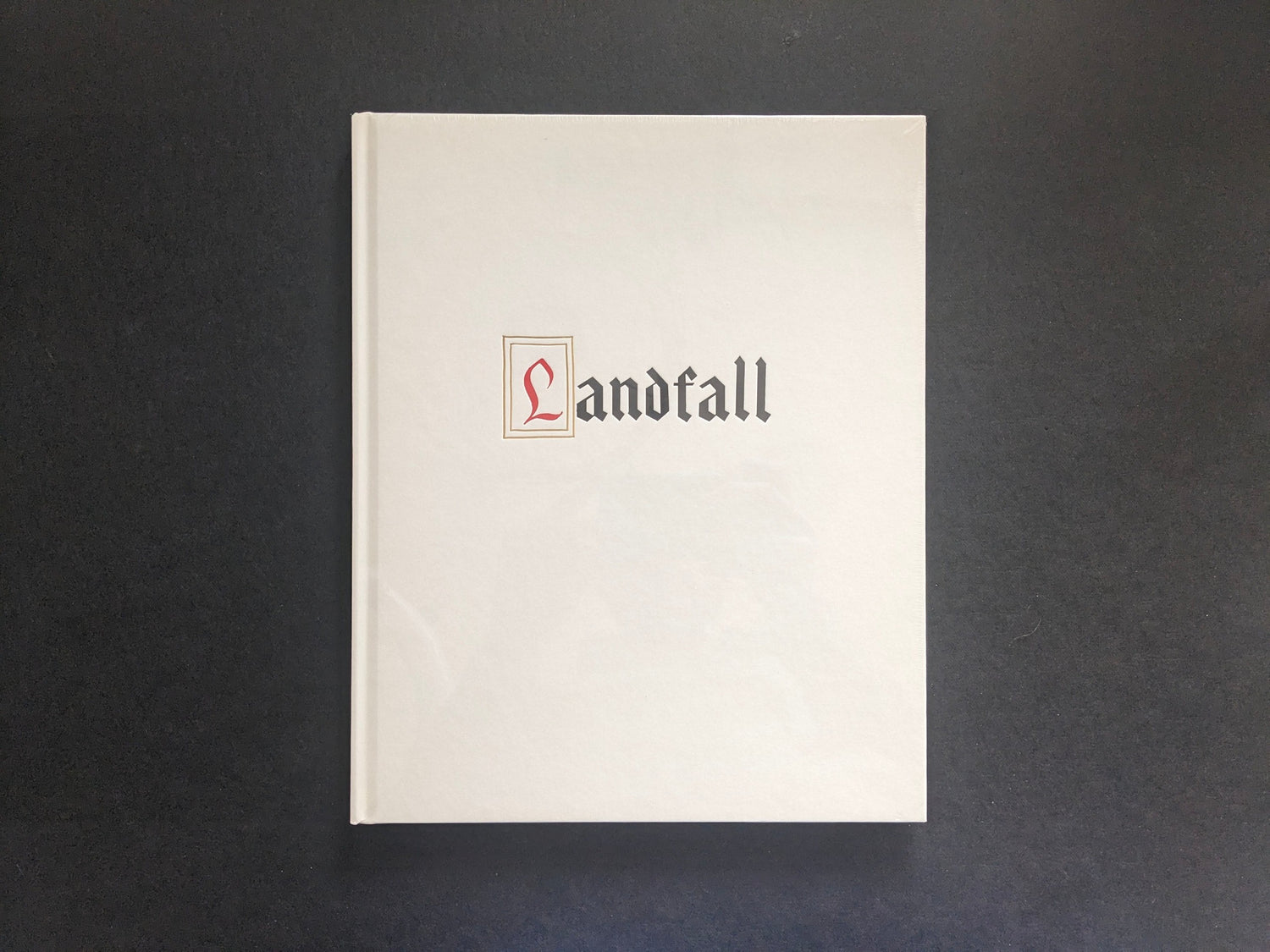 Front cover of Mimi Plumb’s Landfall photobook, white cover with vertical title.