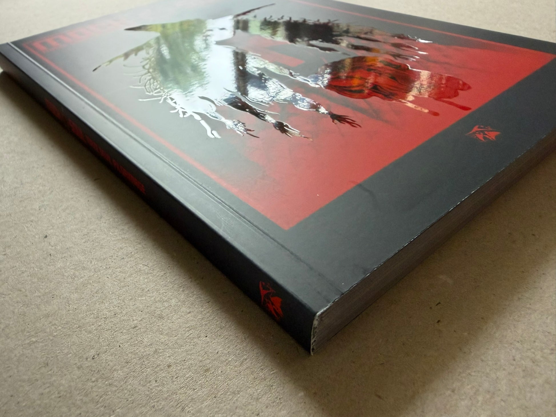 Mock Soul "maze devil pilgrimage" softcover shown at an angle, with the red-and-black cover art visible on the front and spine.