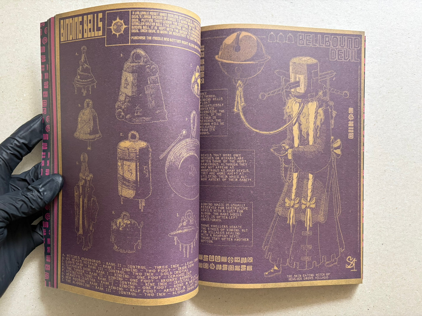 Interior spread of Mock Soul "maze devil pilgrimage" with bell illustrations on the left page and a standing figure on the right page.