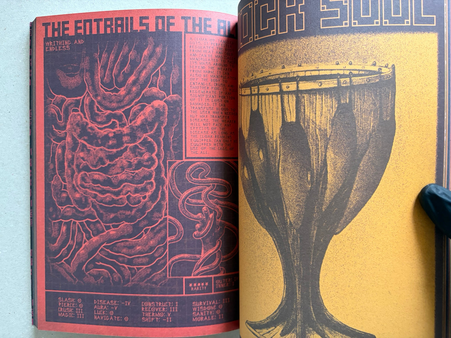 Interior spread of Mock Soul "maze devil pilgrimage" with orange-and-black hand and sword illustrations and a large blade on the right page.