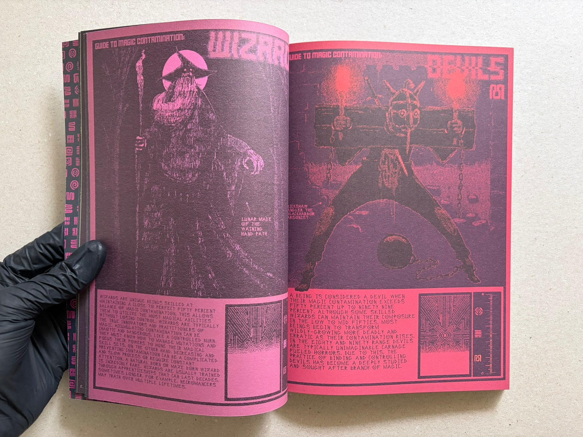 Interior spread of Mock Soul "maze devil pilgrimage" showing a pink-and-black wizard spread with a skull on the right page.