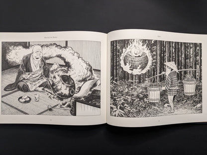 Open book displaying black and white illustrations on a dark background