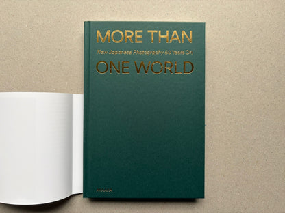 Back cover of More Than One World – New Japanese Photography 50 Years On, with the title in gold on a plain green field and a white band at the bottom.