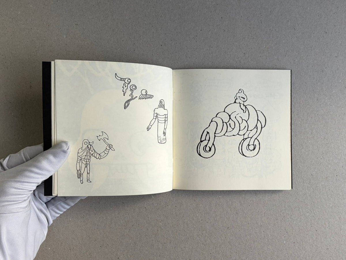 Open sketchbook spread from Multiforce Shit by Mat Brinkman, showing small black line drawings on the left page and a larger abstract figure on the right page.