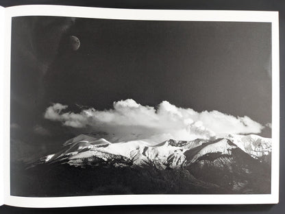 Monochrome landscape with clouds, mountain ridge and moon, by Toshiki Nakanishi