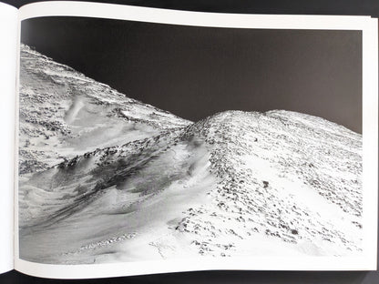 Aerial view of snow-covered volcanic slope, from Toshiki Nakanishi’s photobook