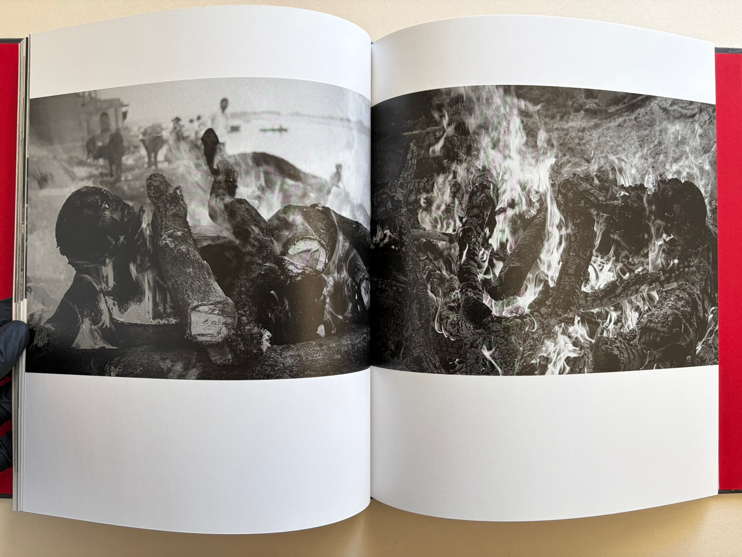 Interior spread from Naked City Varanasi showing burning funeral pyres in close detail.