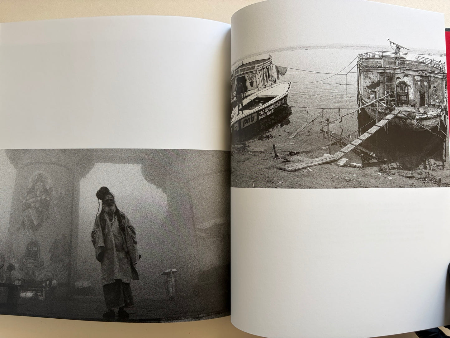 Interior spread from Naked City Varanasi showing a solitary figure in fog and a damaged riverside structure by the water.