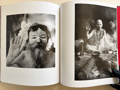 Interior spread from Naked City Varanasi showing two black-and-white portraits of men raising a hand toward the camera.