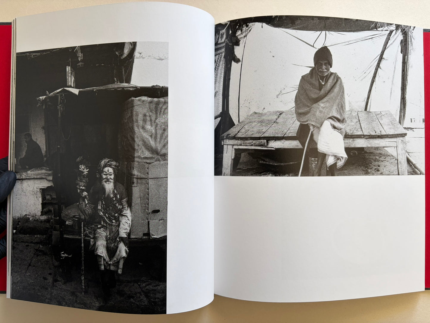 Interior spread from Naked City Varanasi showing two portraits of elderly men seated near the ghats.